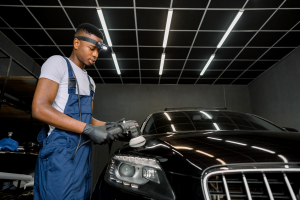 car-detail-denver-colorado technician buffing a car